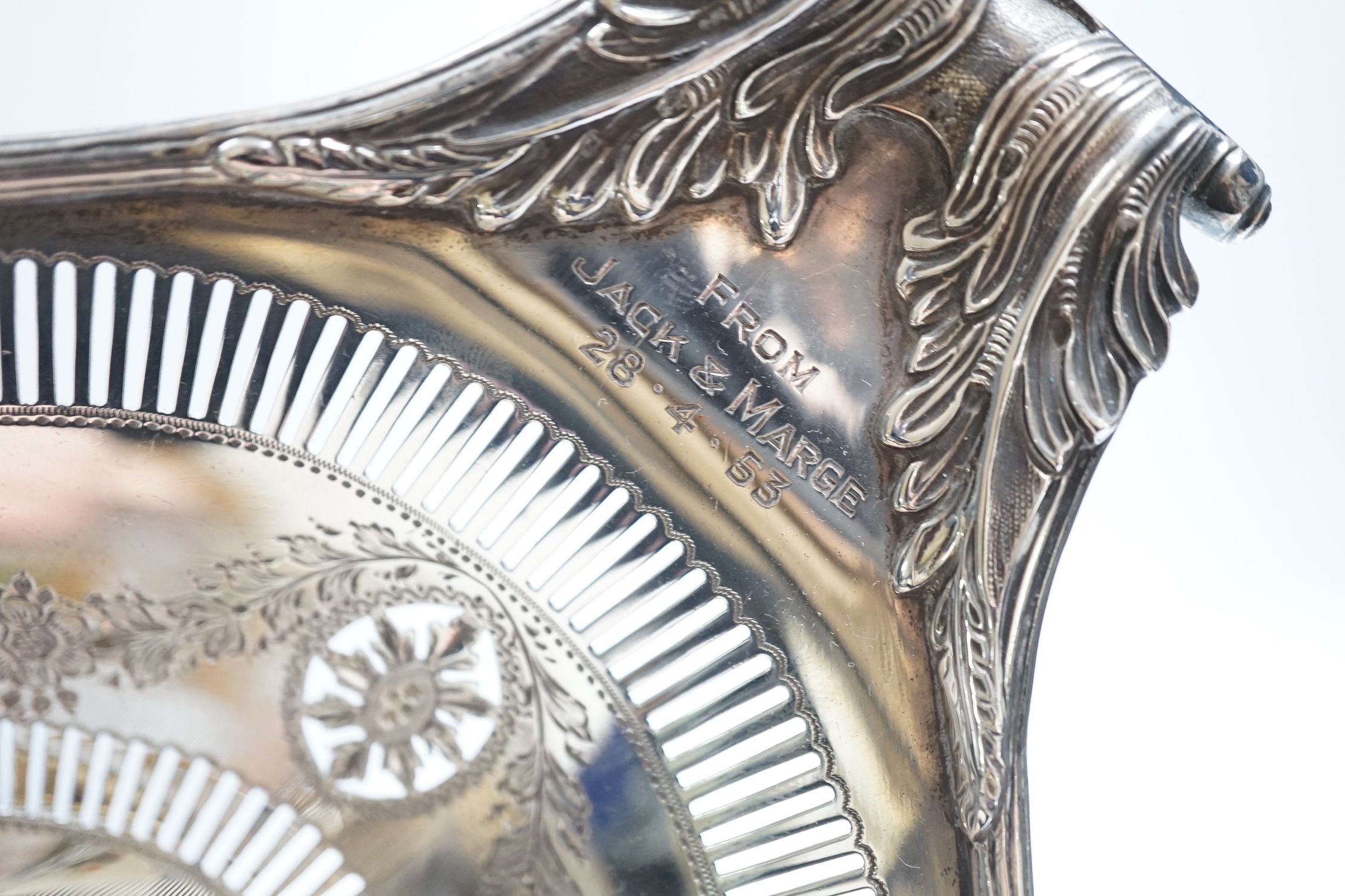 An Edwardian pierced silver two handled oval pedestal dish, with engraved inscriptions, Thomas Bradbury & Sons, Sheffield, 1907, 36.9cm, 18.8oz.